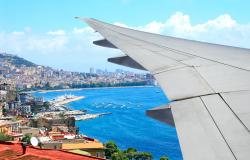 Plane flying over Naples Italy