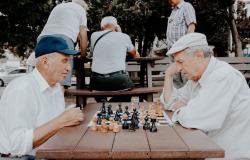 Older Italian men playing a game of chess