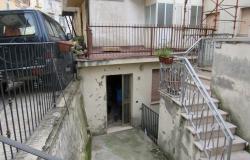 Partly renovated, habitable, 2 bedroom, stone house in the old part of town with terrace and courtyard. 1