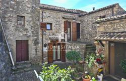 Stone-built house with paved garden 0