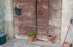 Doorway to storage room below property