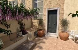 High front door with travertine moulding