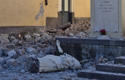 Toppled statue and rubble in Sicilian village after earthquake struck