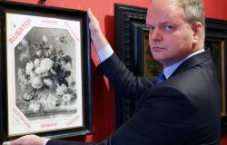 Uffizi director Eike Schmidt holds copy of painting stolen during World War II