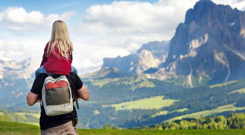 Father and daughter in Italian Alps