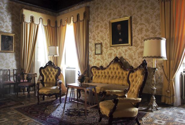 Salon with coffered wood ceiling and antique floor tiles