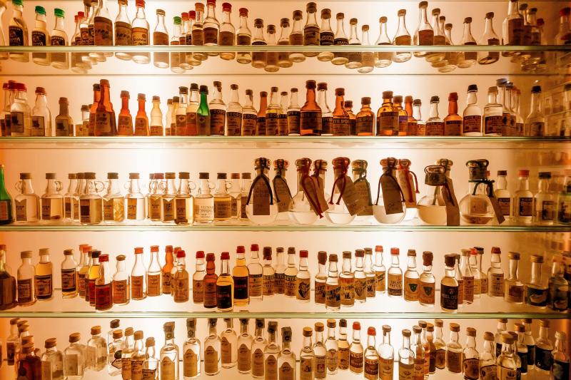 vintage grappa bottles on the shelves in Bassano del Grappa