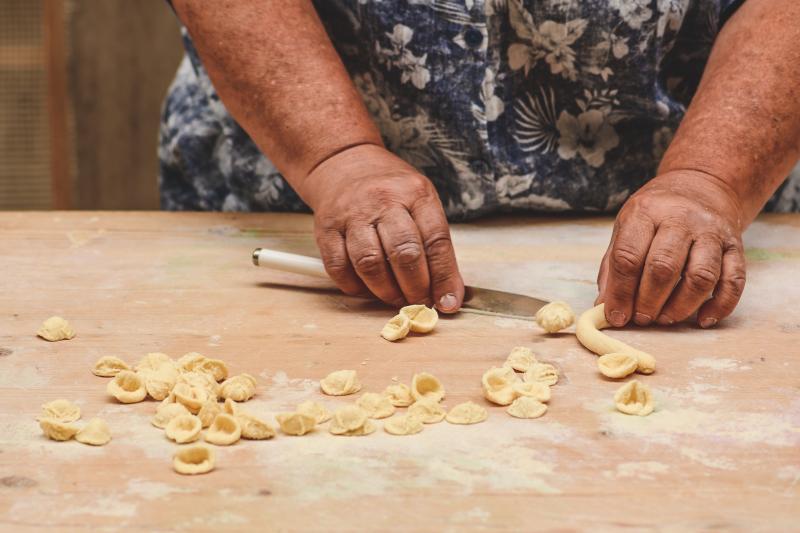 A woman making orecchiette in Bari / Photo: Michele Ursi via Shutterstock