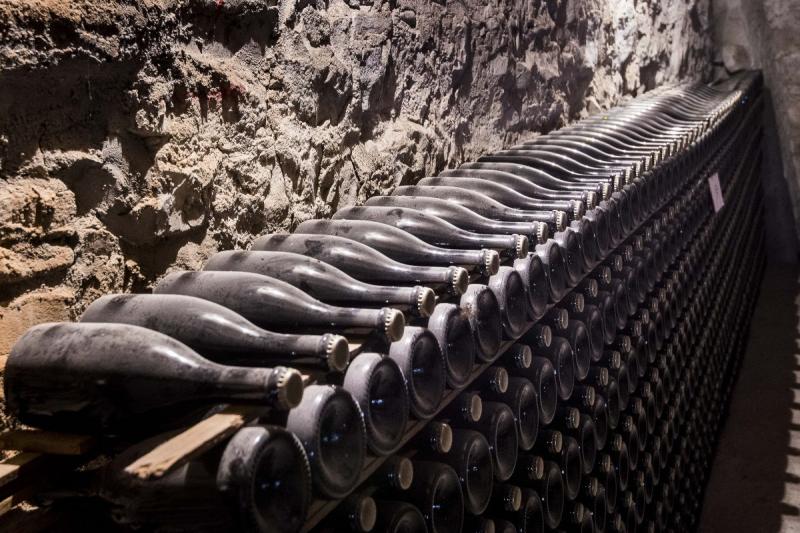 bottles aging in winery in Parma italy