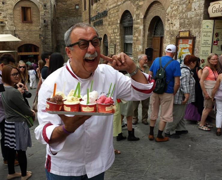 Sergio Dondoli gelato chef with a tray of gelato cups