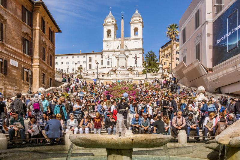 Tourist crowds sit on Spanish Steps in Rome